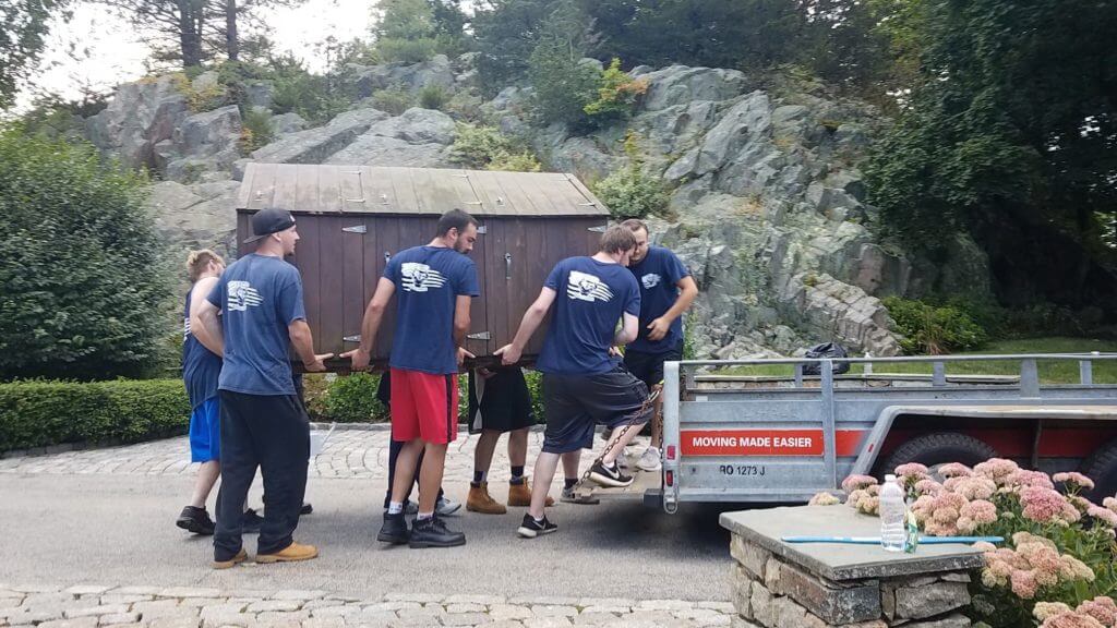 movers moving a shed