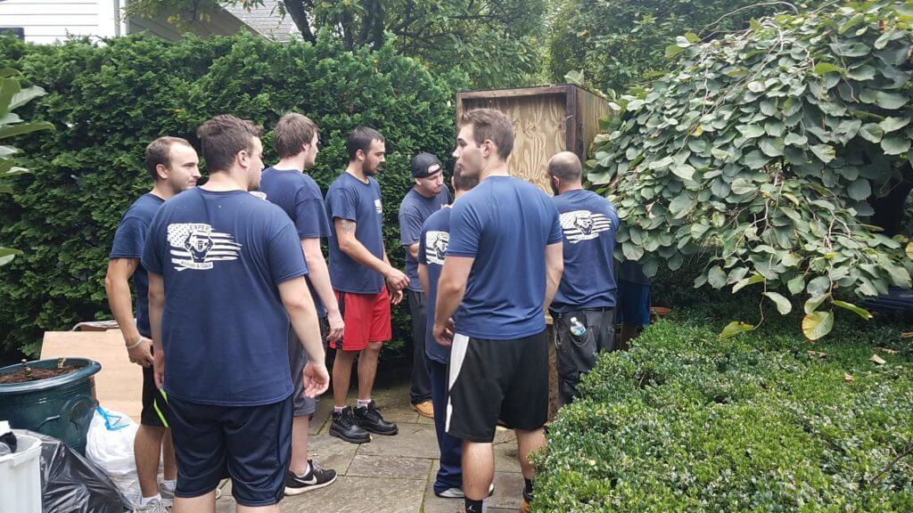 movers moving a shed