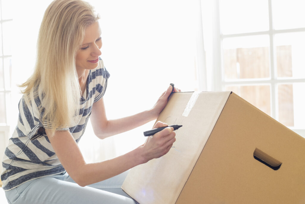 Woman labeling box